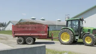 Tractor hauling manure