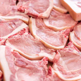 a close up photo of pork chops