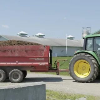 Tractor hauling manure