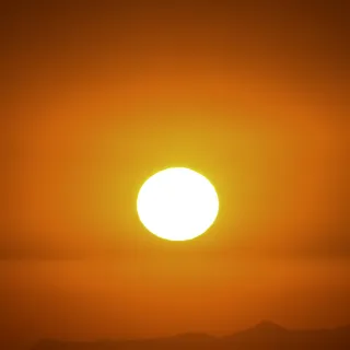 A glowing orange sun